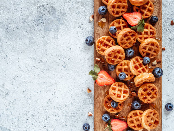 istock delicious soft belgian waffles with berries, copy space 1151785689