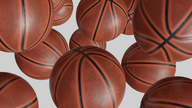 istock orange basketball balls isolated on white background. 3d rendering 1151786860