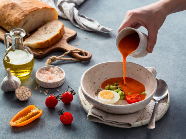 istock Hand pouring of Gaspacho soup 1151786875