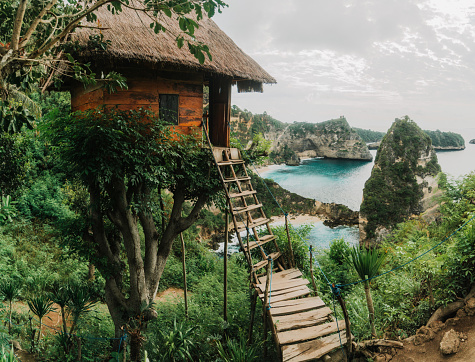 Scenic view of wooden tree house near the sea on Nusa Penida, Bali, Indonesia