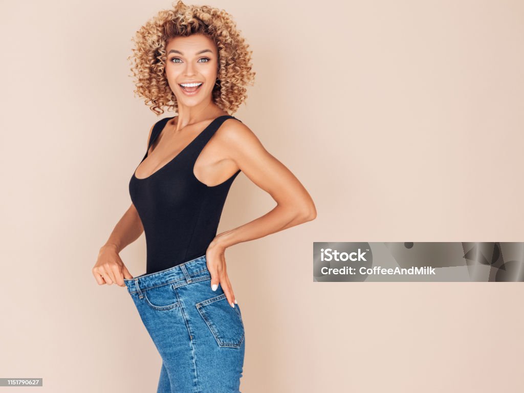 Young woman losing weight Dieting Stock Photo