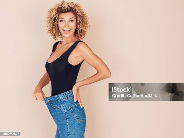 Young Woman Losing Weight Stock Photo - Download Image Now - Dieting, Women, Weight