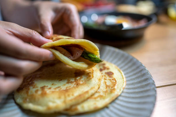 istock homemade crepe pancake, stuffed with bacon, asparagus and fried egg 1151791106