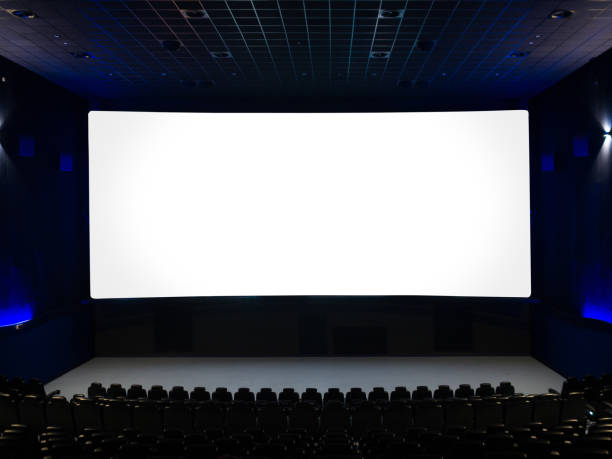istock Empty movie theater with empty large screen. 1151792439