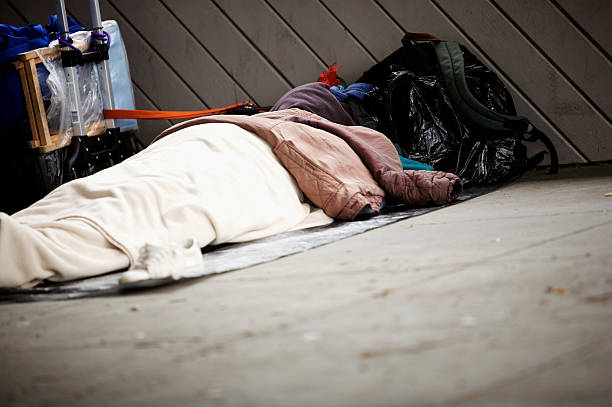 istock homless person asleep 115179316