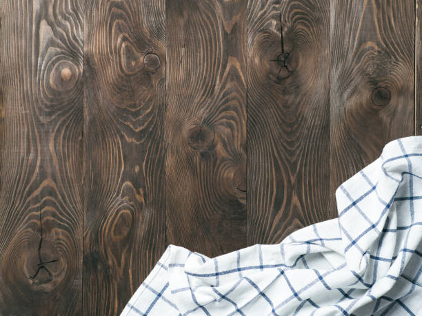 istock linen napkin on wooden table, top view, mock up 1151794591