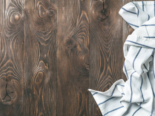 istock linen napkin on wooden table, top view, mock up 1151794604