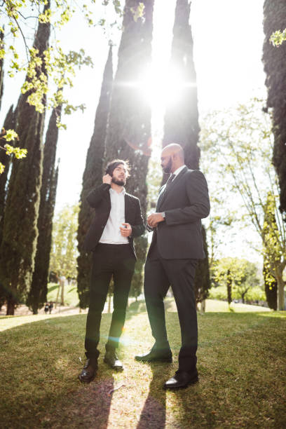 istock business man talking together in the park 1151794747
