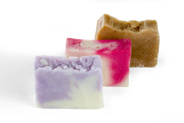 istock Three different handmade pieces of soap isolated on white background. 1151795745