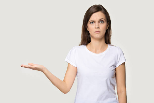 istock Dissatisfied woman showing empty open palm copy space studio shot 1151796112