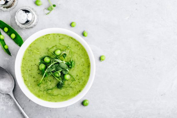 istock Summer cream soup with green fresh pea shoots 1151798468