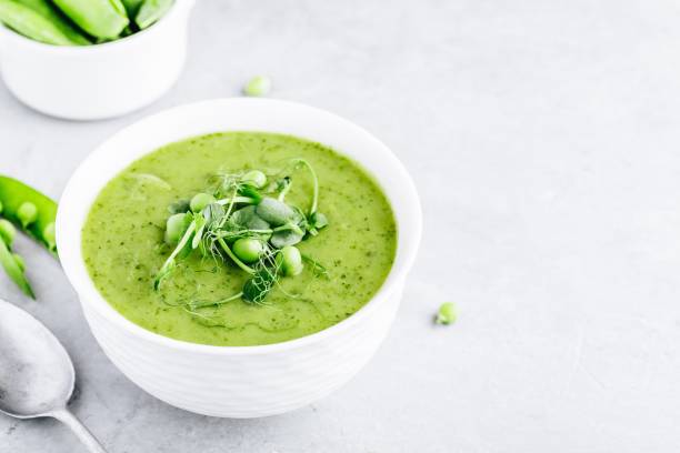 istock Summer cream soup with green fresh pea shoots 1151798486
