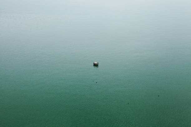 A metal barrel floating in the Yangtze river.