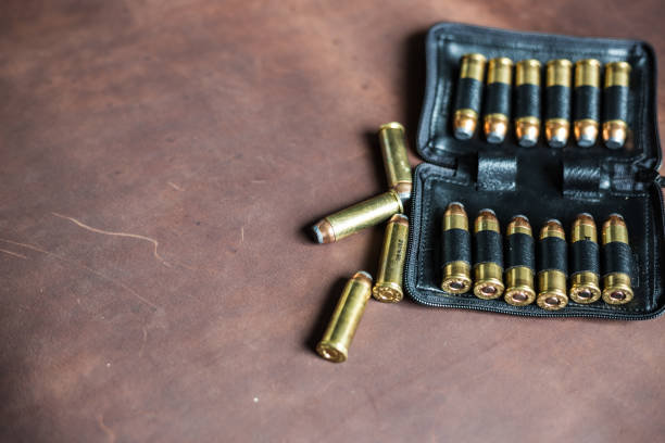 istock .44 magnum jacket soft point bullet on leather texture 1151799288