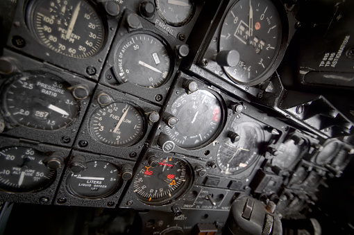 Many dials and needles in the vintage Vought F-8 Crusader aircraft cockpit
