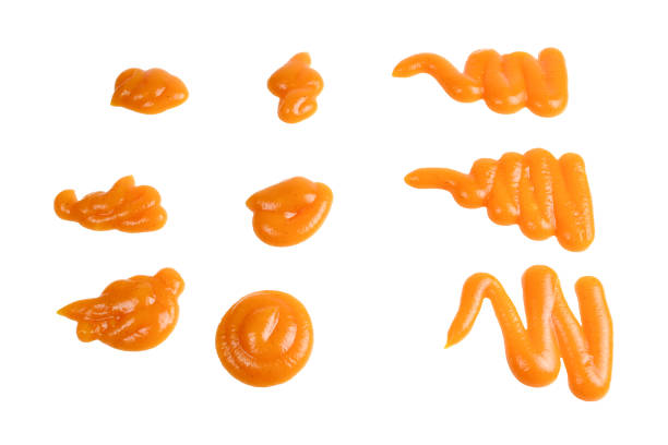 istock Orange sauce splashes isolated on white background 1151801964