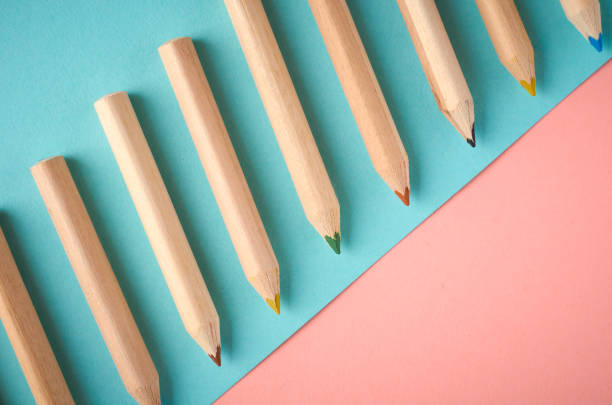 istock Wooden color pencils on blue background, flat lay 1151802441
