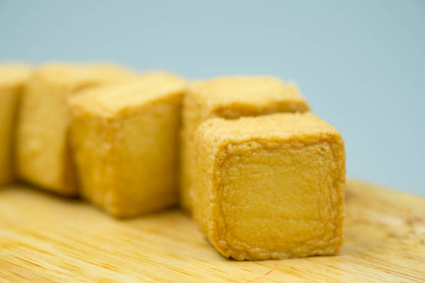 istock Fish meat tofu, yellow meatball square shape. Selective focus 1151802738