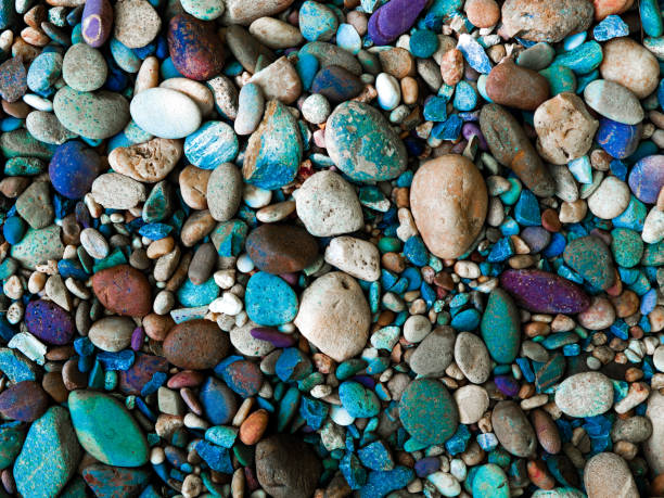 istock Stone background with round colorful pebbles 1151803631