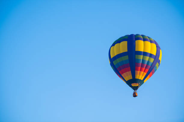 istock Colourful of balloon on blue sky with copy space 1151806140