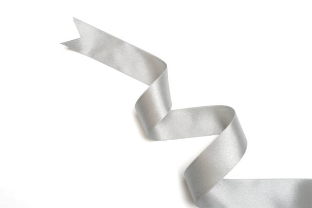 istock Silver ribbon in roll on white background 1151808398