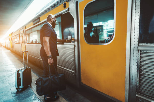 A back fancy man entering the train