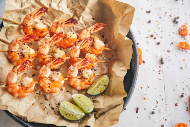 istock Grilled shrimps with seasoning and lime 1151809495
