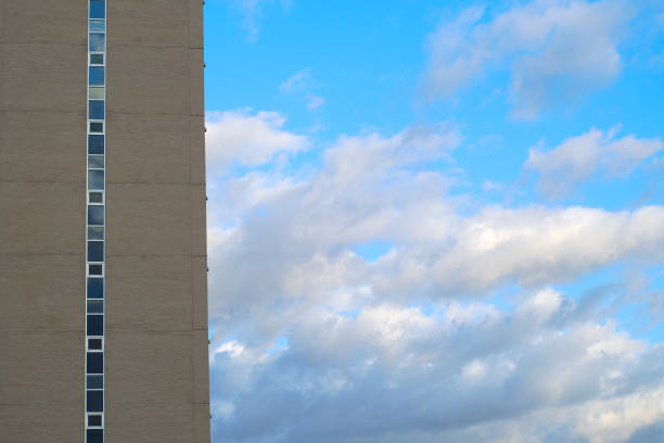 building skyscraper blue sky clouds background vertical urban