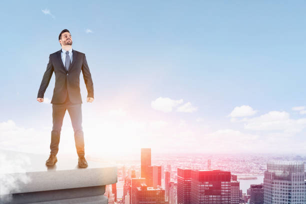 istock Confident businessman standing on city roof 1151815555