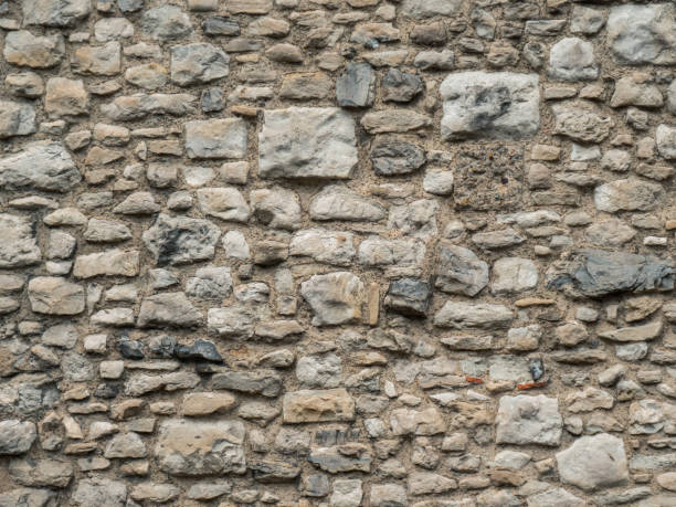 istock Texture of a stone wall close up 1151815948