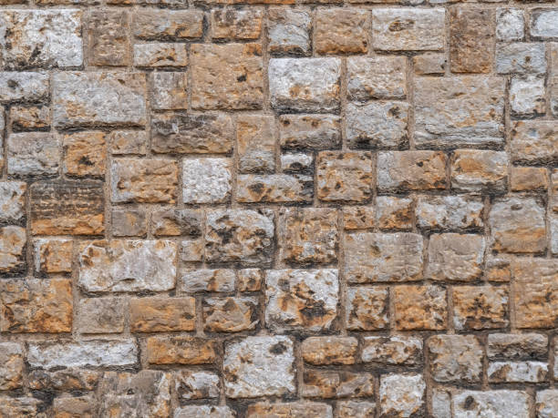 istock Texture of a stone wall close up 1151815959