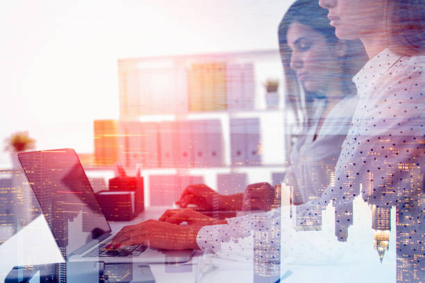 istock Two serious businesswomen working in office 1151817360
