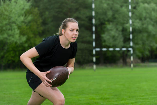 istock Girl playing rugby together outside in summer 1151817792