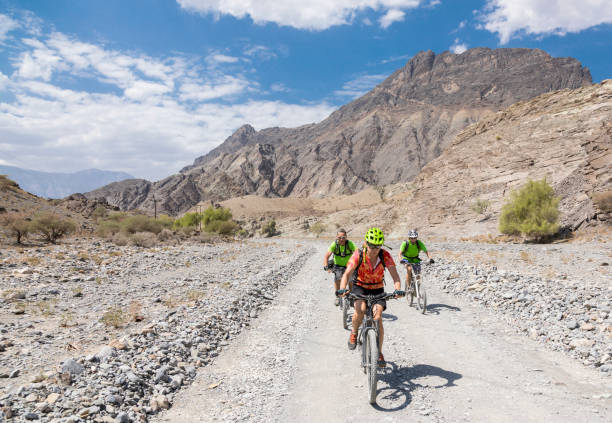 istock Three mountainbikers on gravel roads, Oman. 1151819997