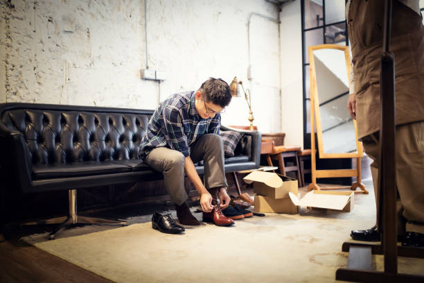 istock Young Man Buying New Shoes 1151820704