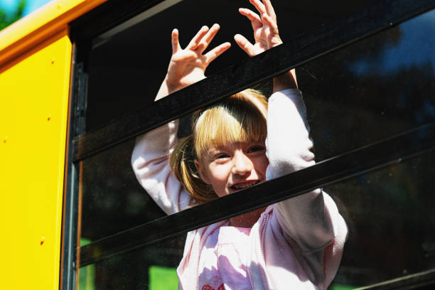 istock Girl on School Bus 1151823890