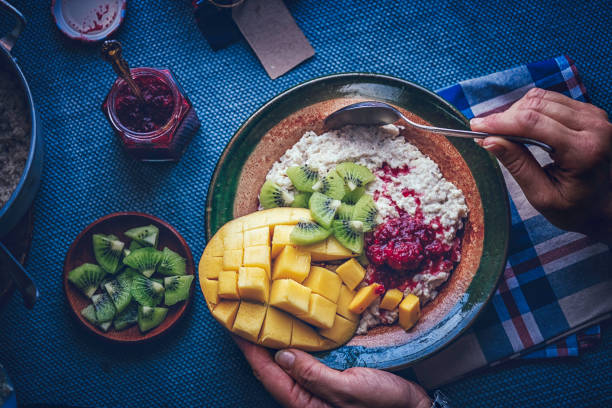 istock Healthy Porridge with Mango, Kiwi and Raspberry for Breakfast 1151826386