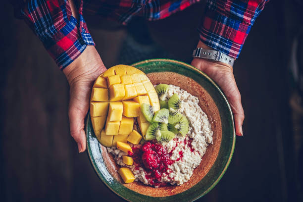 istock Healthy Porridge with Mango, Kiwi and Raspberry for Breakfast 1151826620