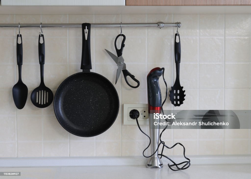 https://media.istockphoto.com/id/1151828927/photo/non-stick-frying-pan-scissors-for-food-a-spatula-for-turning-steaks-a-spoon-a-blender-against.jpg?s=1024x1024&w=is&k=20&c=9jE-h8AYQyvTAa2yVncvNqerDlcb50L1XgiKJi2Y3j4=