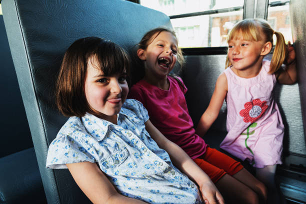 istock Girls on School Bus 1151830812