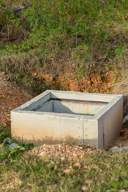 istock Concrete construction tube pipe. Building a road sewer drain system. Sewer construction. 1151830818