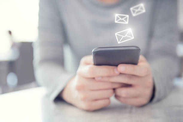 istock Email concept, Closeup Woman hand using mobile smartphone with email icon, copy space. 1151832325