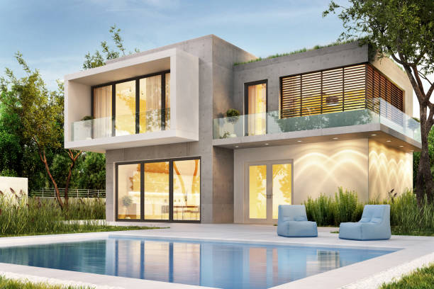 istock Evening view of a modern home with lighting and a swimming pool 1151833062