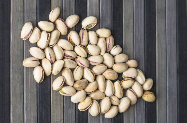 istock Healthy food  for background image close up pistachios nuts. Texture Nuts on top view mock up pistachio 1151836309