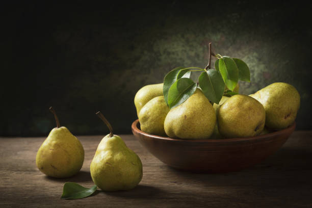istock still life with fresh pears with leaves in a bowl 1151841073