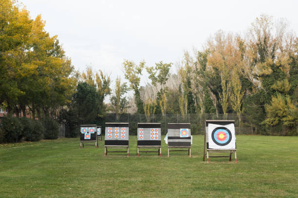 istock Outdoor archery targets on grass field surrounded by forest. 1151841307