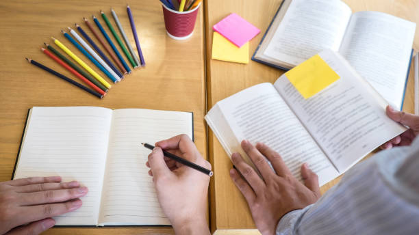 istock Group of young people learning studying new lesson to knowledge in library during helping teaching friend education prepare for exam, youth campus friendship teenager teens concept 1151843849