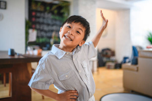 istock Happy Taiwanese Boy Gesturing With Hand on Hip 1151845431