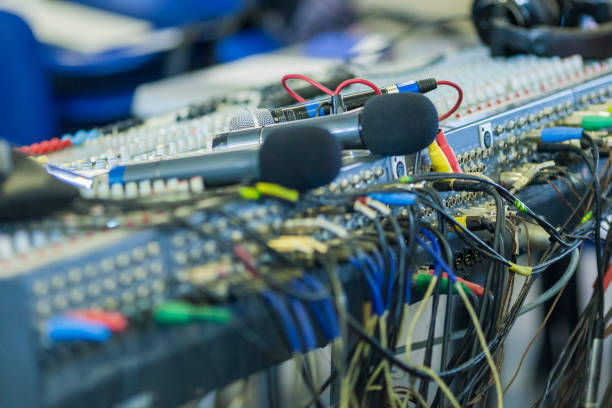 istock Professional Mixing Console Back Panel Closeup. Wireless Microphones on Foreground. Hrizontal Shot 1151846302