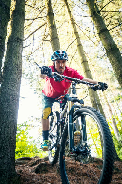istock Extreme mountain biker riding over rough terrain 1151846649